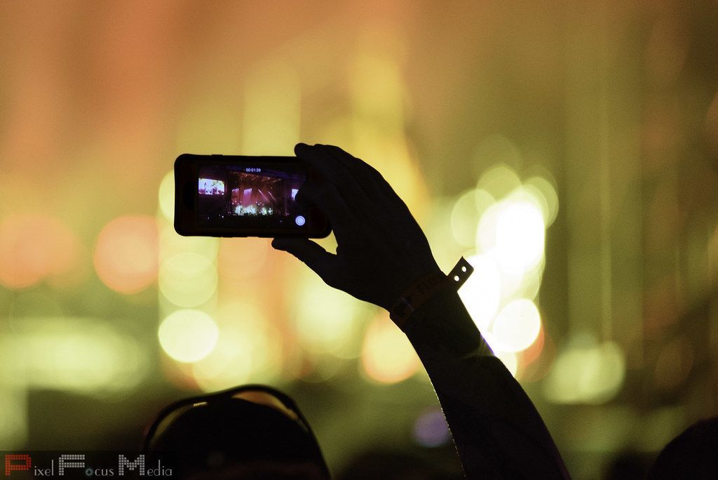 Fans filming a concert